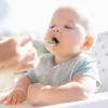 Baby-being-spoon-fed-1-1024x1024.webp