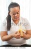 stock-photo-fat-asian-woman-with-banana-on-white-443928811.jpg