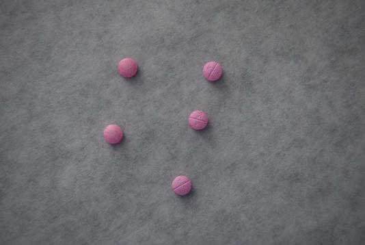 A group of counterfeit K56 pills, which contain fentanyl, is displayed as tests are conducted on seized drugs at the Houston Forensic Science Center in Houston on March 29, 2023. Credit: Callaghan O'Hare for The Texas Tribune