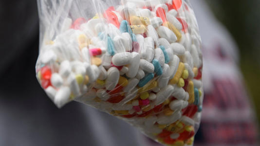 Assorted pills and prescription drugs, including opioids, being disposed of as part of a Prescription Drug Take Back Day in Los Angeles.